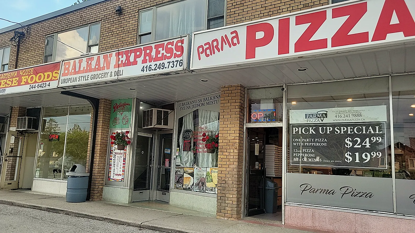 Parma Pizza storefront on Scarlett Road with the pickup special in the window
